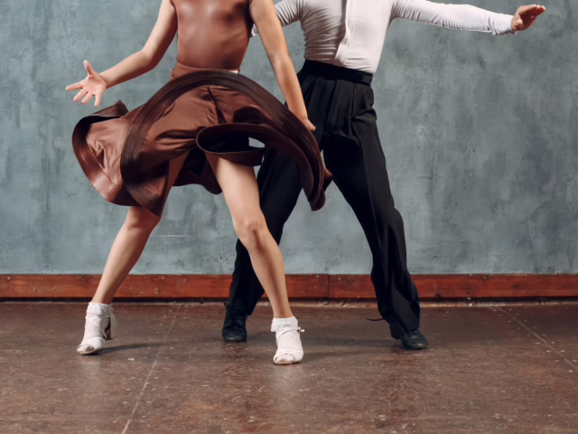 Young couple boy and girl dancing in ballroom dance Samba